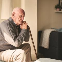 Older man sitting on couch