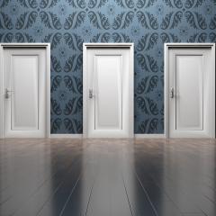 Seven closed doors in a line