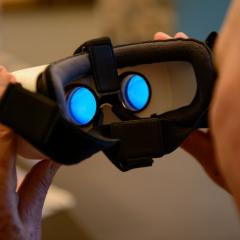 Man holding virtual reality glasses